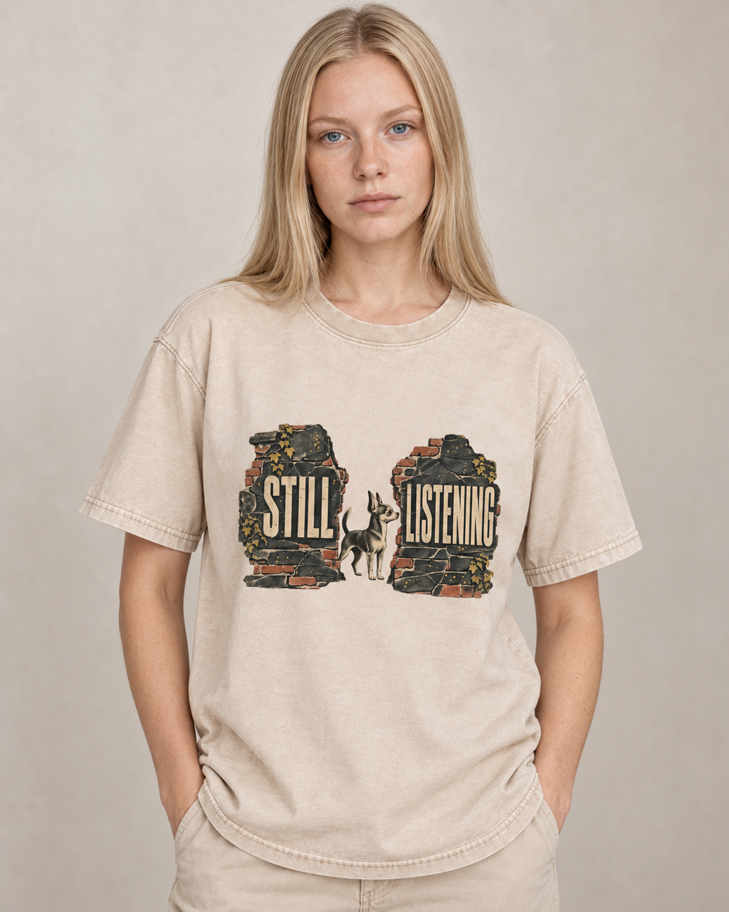 Adult model wears Apricot Chihuahua Still Listening washed T-shirt in a warm studio portrait