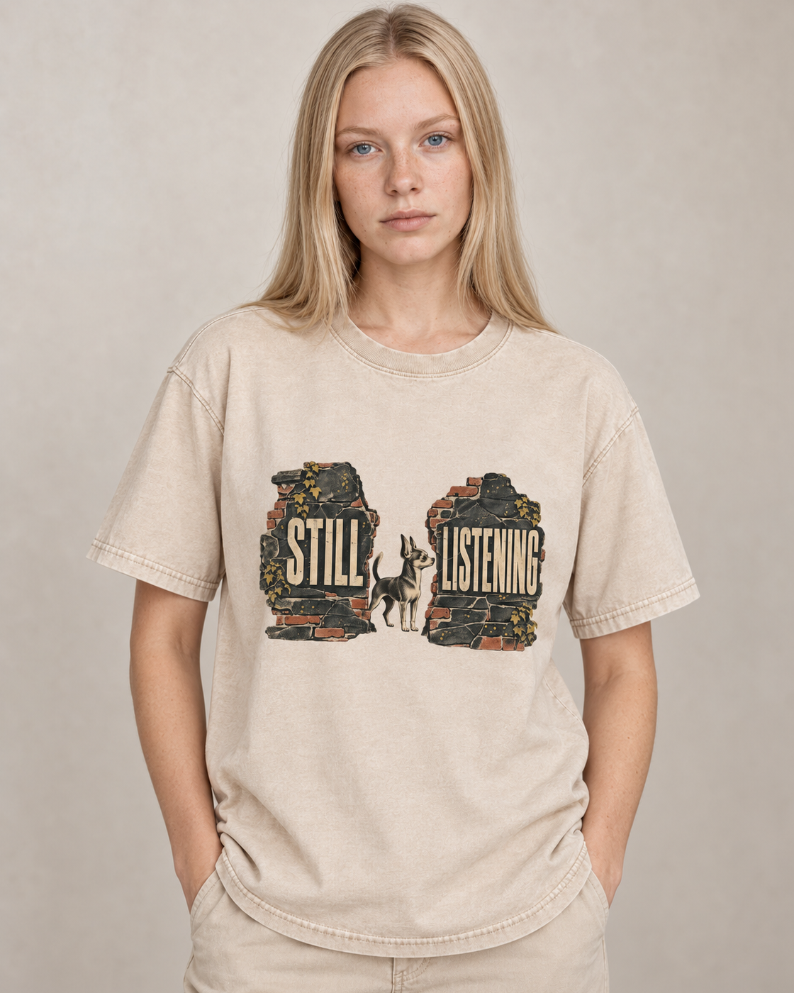 Adult model wears Apricot Chihuahua Still Listening washed T-shirt in a warm studio portrait