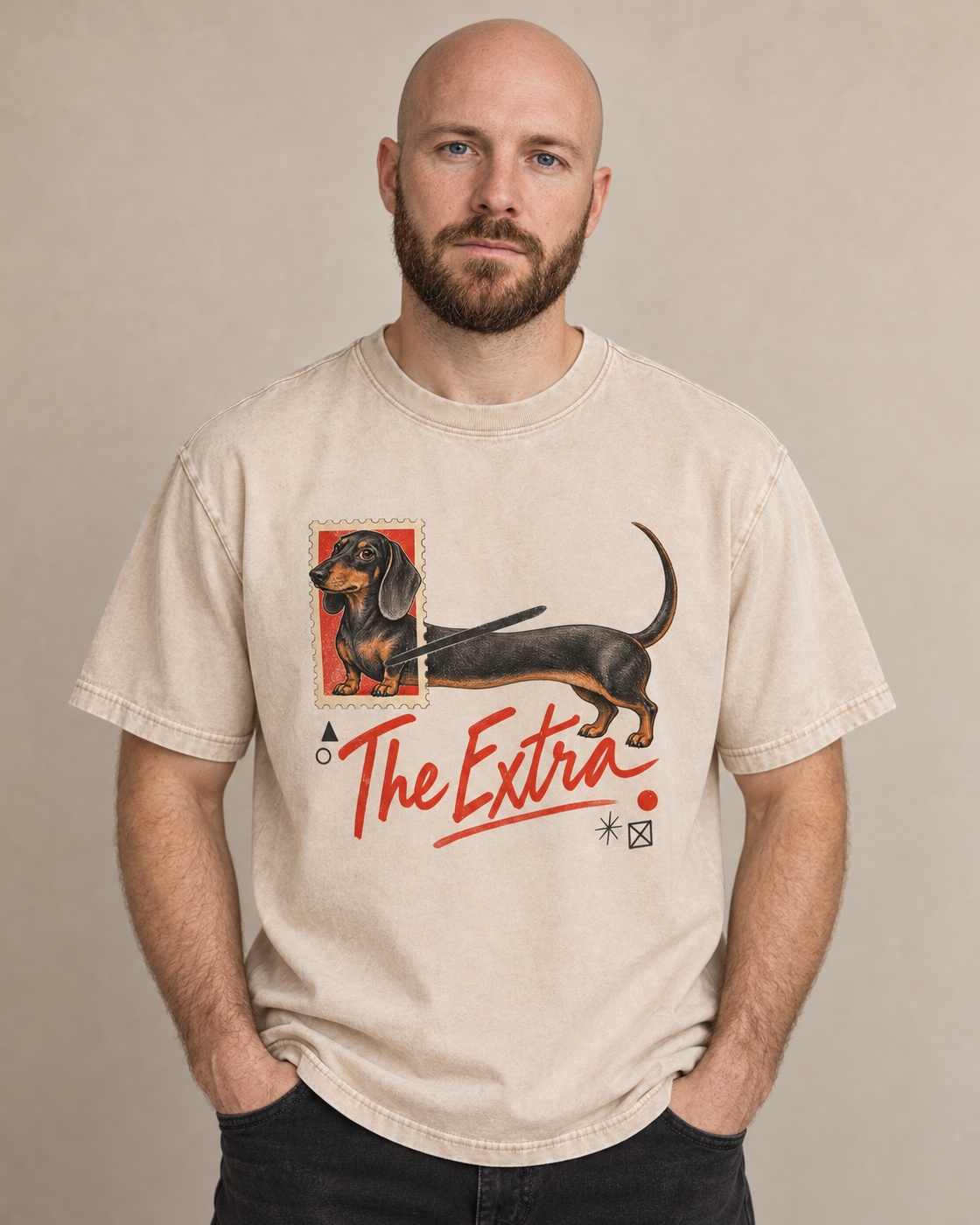 Adult model wears Apricot Dachshund The Extra Postage washed T-shirt in a warm studio portrait