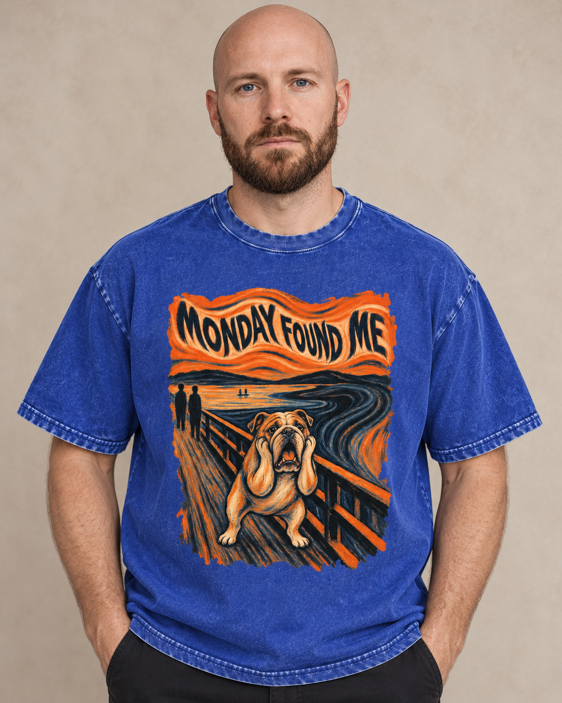 Adult model wears Royal Blue English Bulldog Monday Found Me Scream washed T-shirt in a warm studio portrait