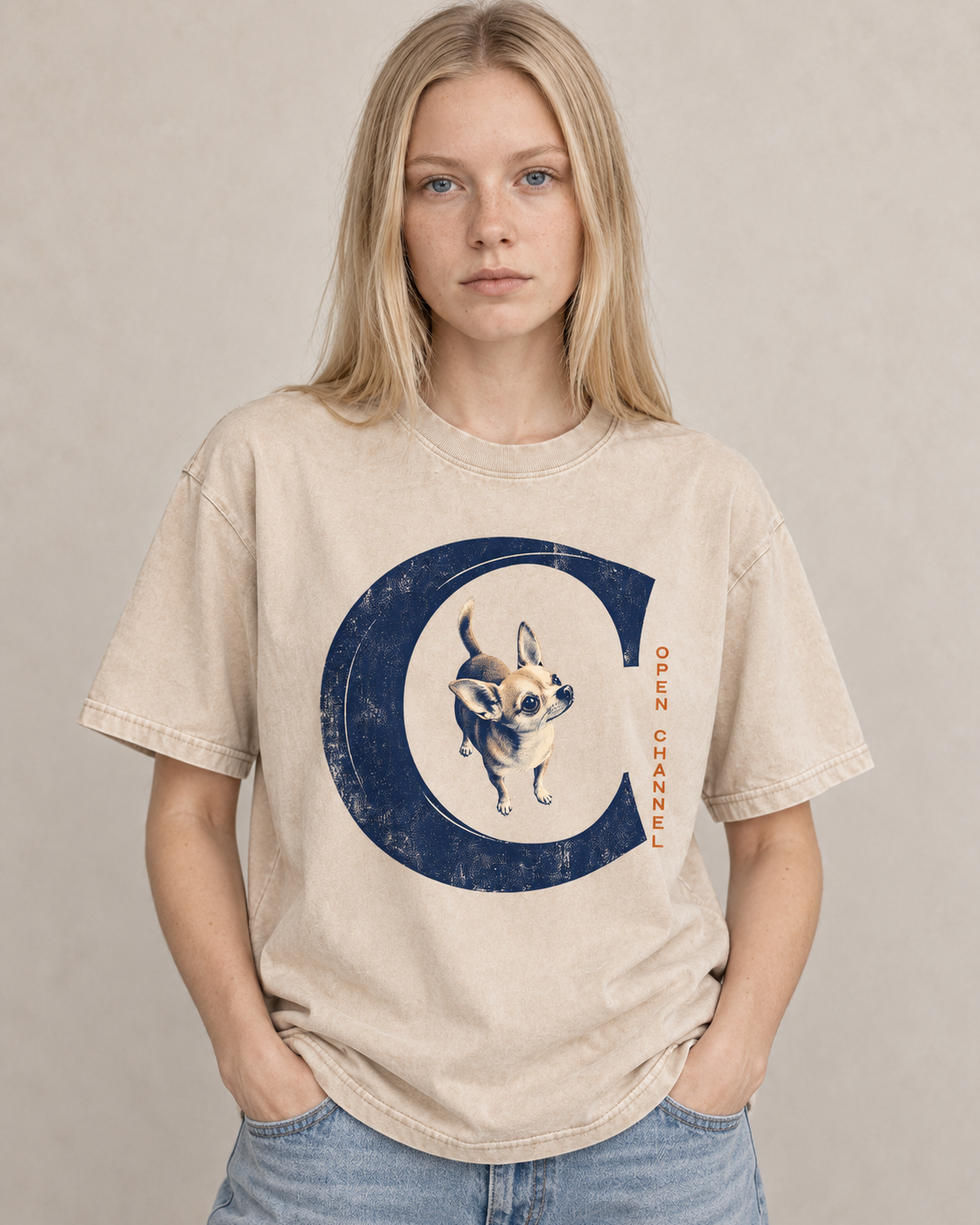 Adult model wears Apricot Chihuahua Open Channel washed T-shirt in a warm studio portrait