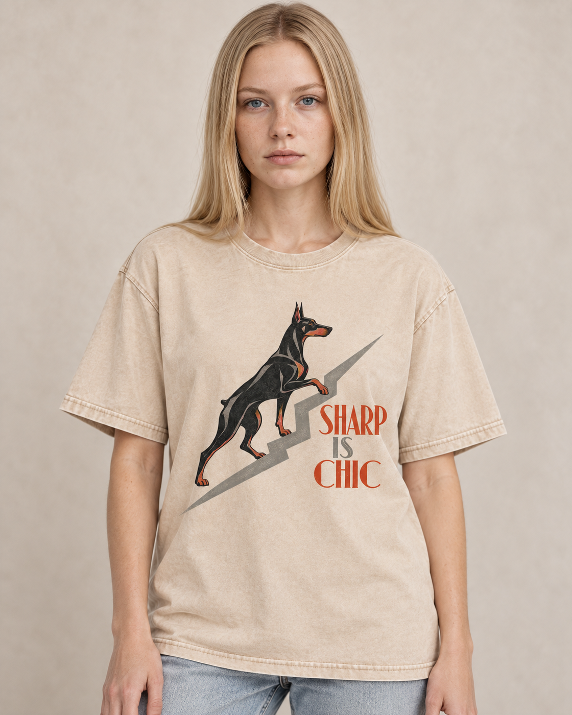 Adult model wears Apricot Doberman Sharp Is Chic Stairway washed T-shirt in a warm studio portrait