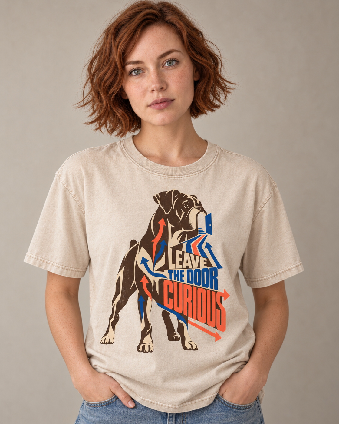 Adult model wears Apricot Boxer Leave the Door Curious Doorway Arrow washed T-shirt in a warm studio portrait