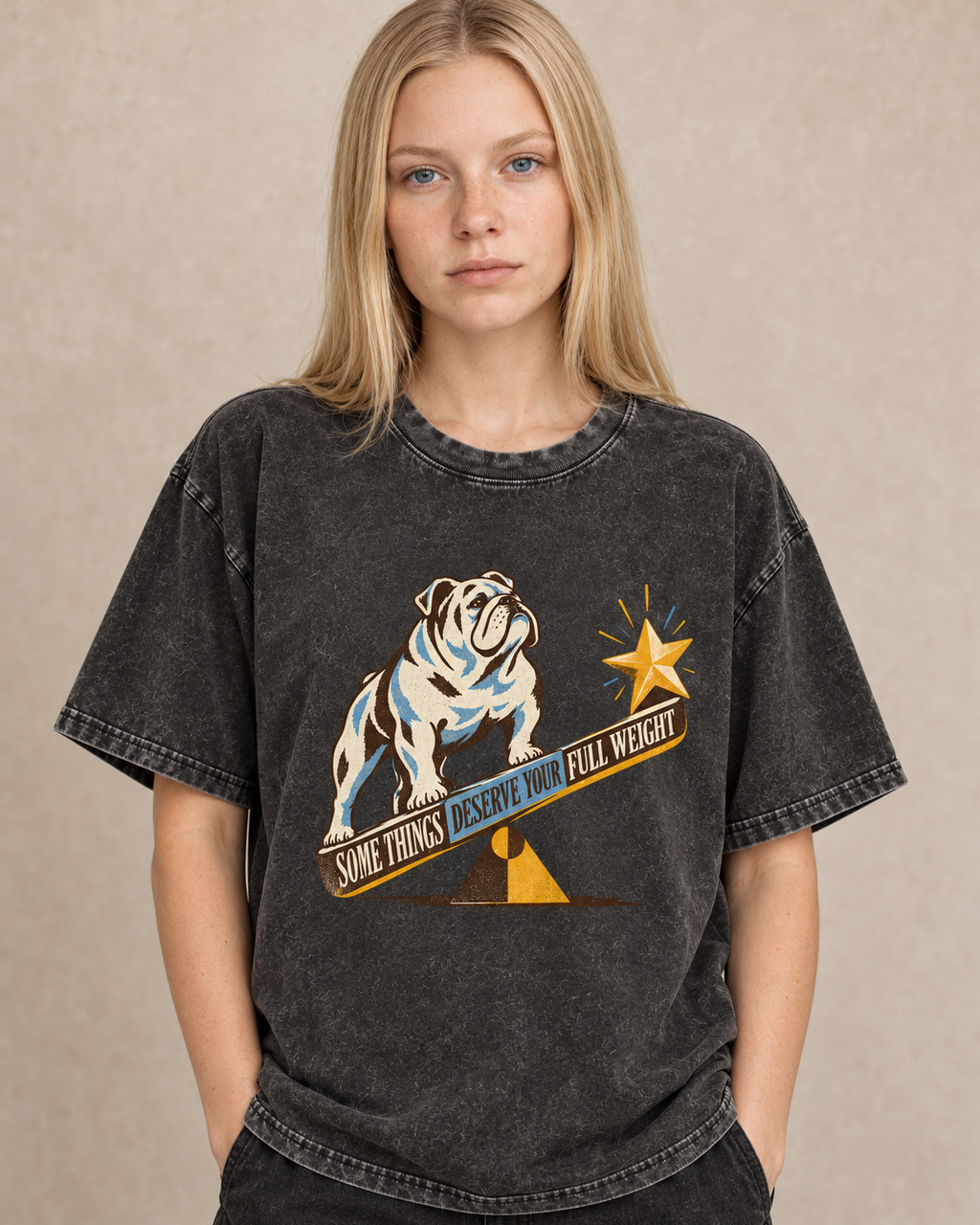 Adult model wears Black English Bulldog Some Things Deserve Your Full Weight washed T-shirt in a warm studio portrait