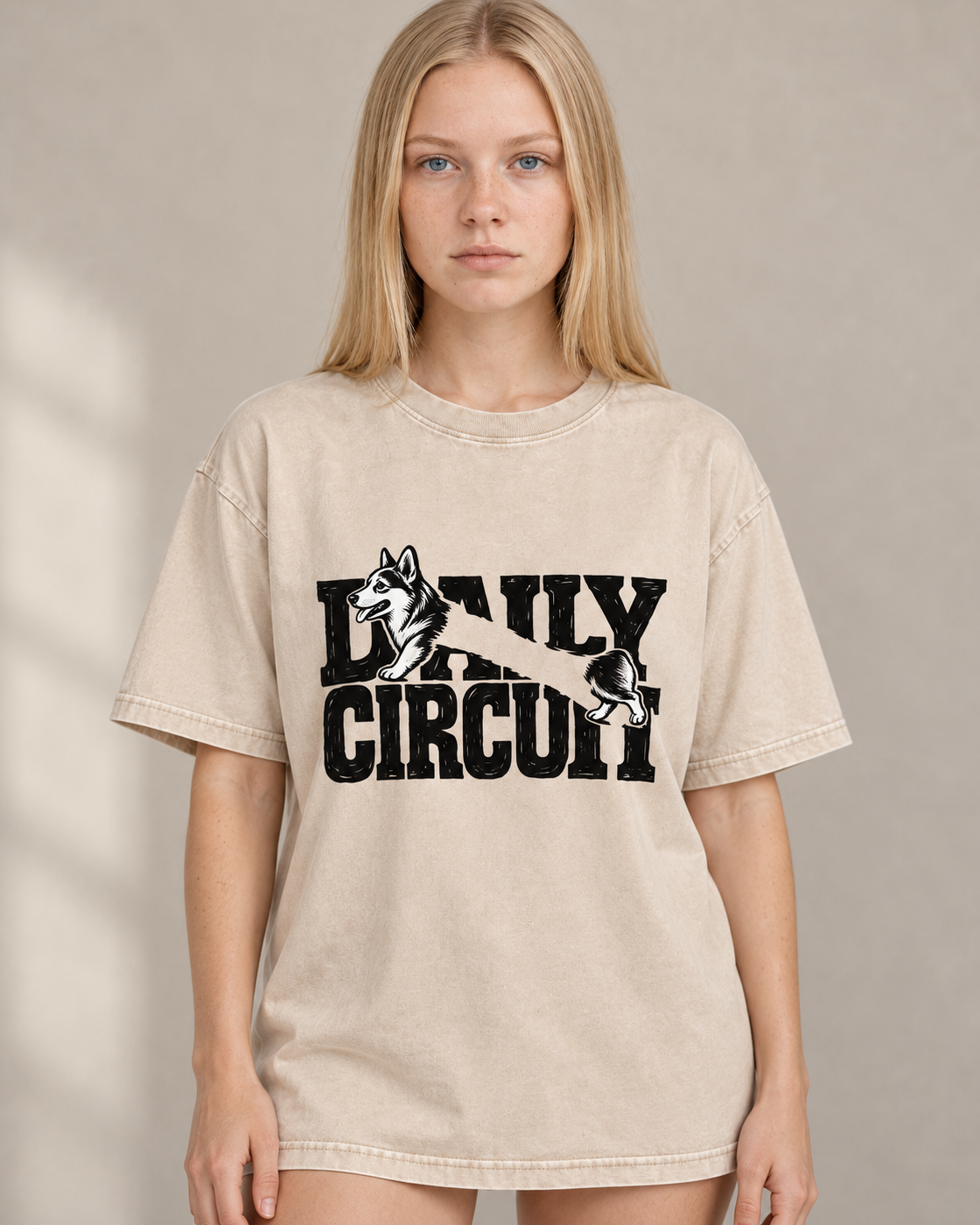 Adult model wears Apricot Corgi Family Circuit Running Letterpress washed T-shirt in a warm studio portrait
