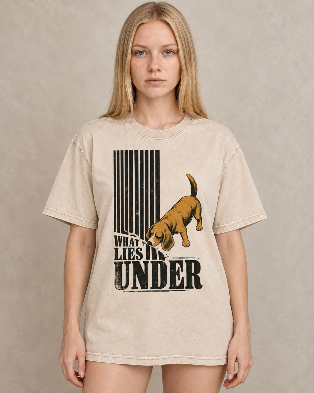 Adult model wears Apricot Beagle Curious What Lies Under washed T-shirt in a warm studio portrait