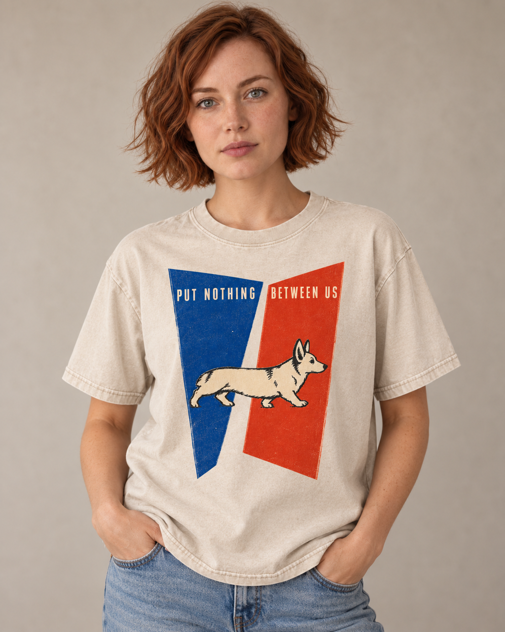 Adult model wears Apricot Corgi Put Nothing Between Us Split Panels washed T-shirt in a warm studio portrait