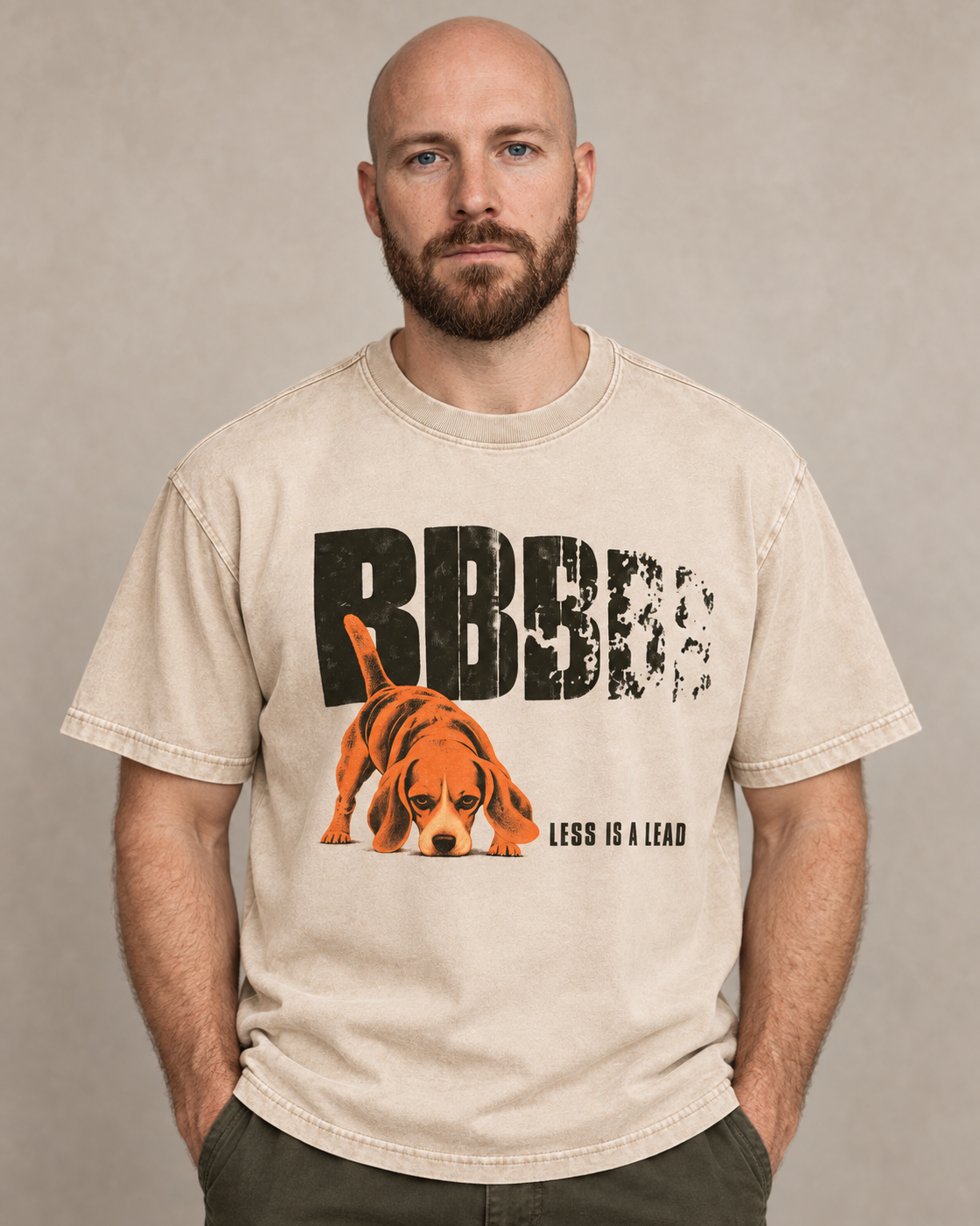 Adult model wears Apricot Beagle Less Is A Lead Tracking Dog washed T-shirt in a warm studio portrait