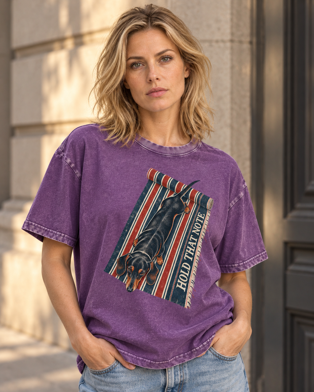Adult model wears Purple Dachshund Hold That Note Striped Rug washed T-shirt in a three-quarter street portrait