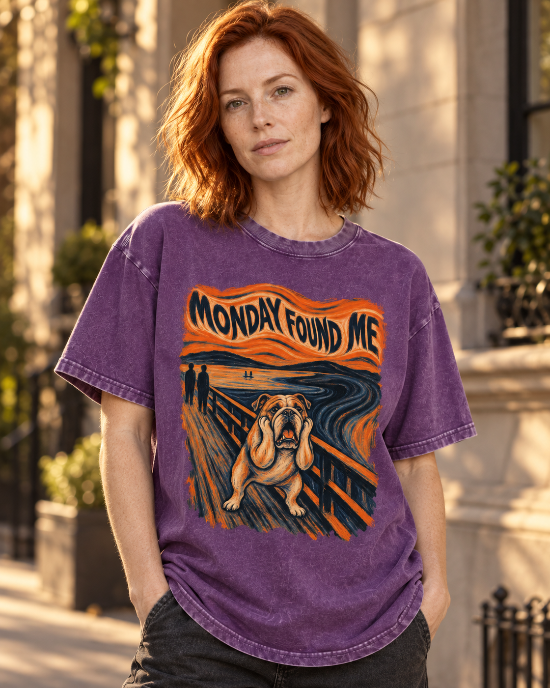 Adult model wears Purple English Bulldog Monday Found Me Scream washed T-shirt in a three-quarter street portrait