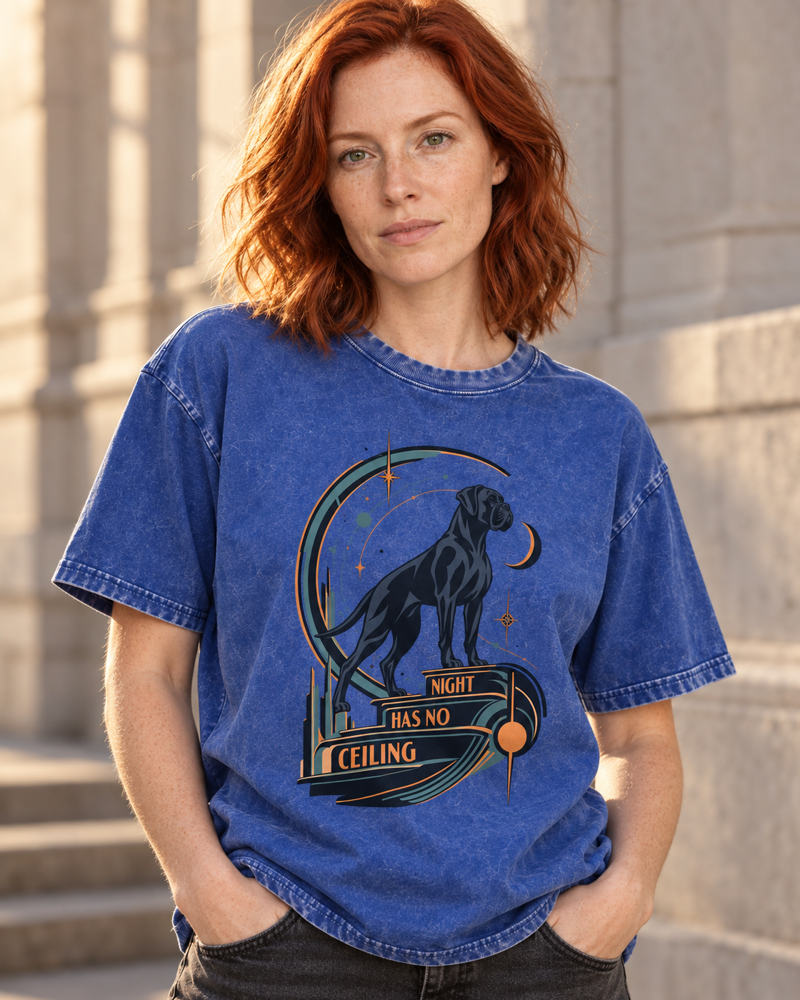 Adult model wears Royal Blue Boxer Night Has No Ceiling Cosmic washed T-shirt in a three-quarter street portrait