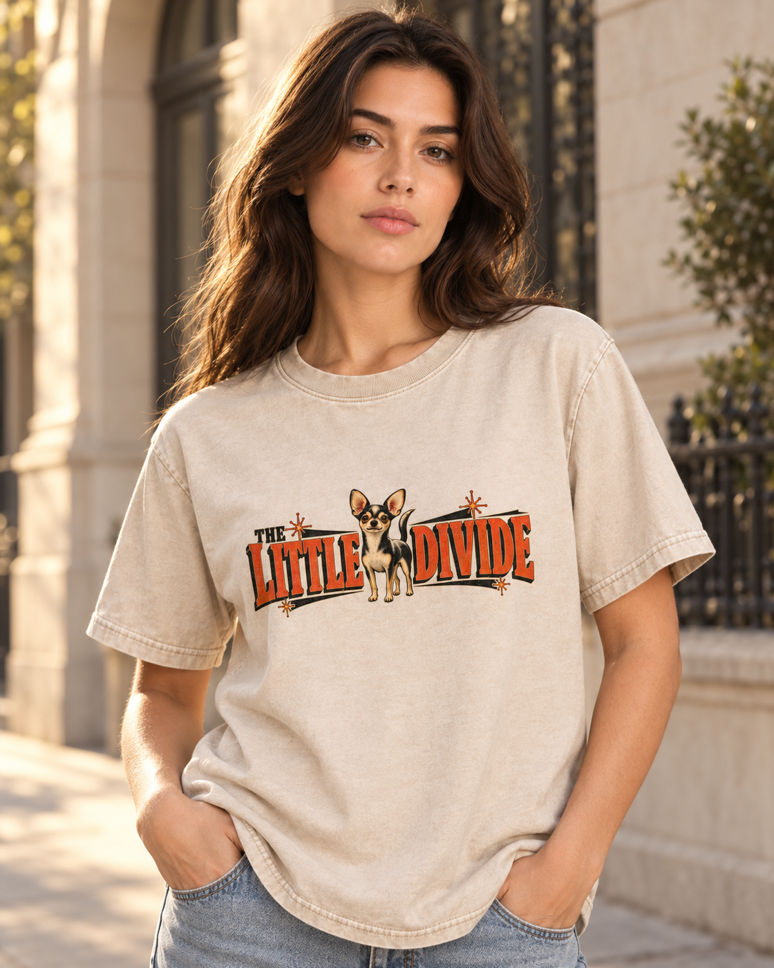 Adult model wears Apricot Chihuahua The Little Divide Retro Sign washed T-shirt in a three-quarter street portrait