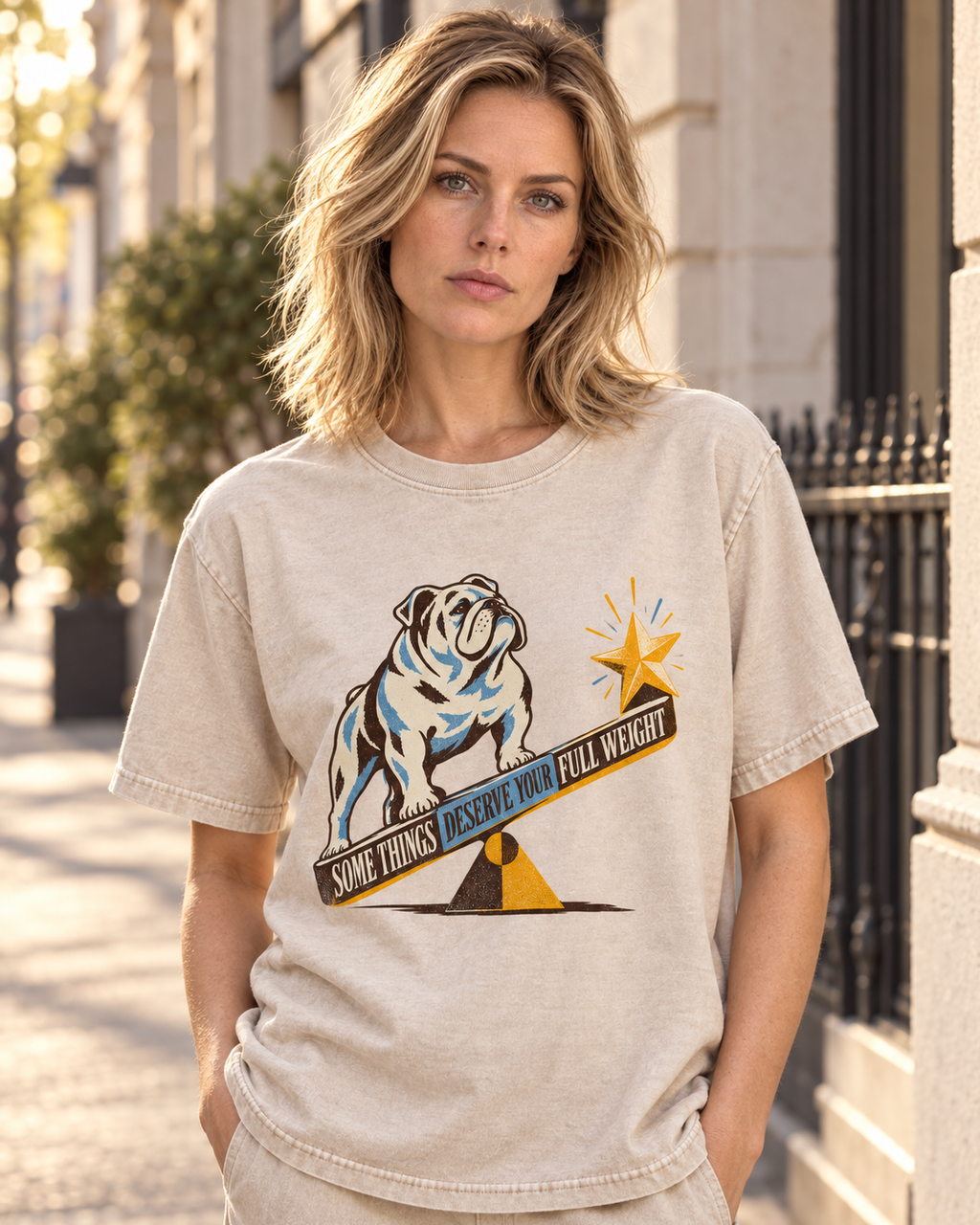 Adult model wears Apricot English Bulldog Some Things Deserve Your Full Weight washed T-shirt in a three-quarter street port