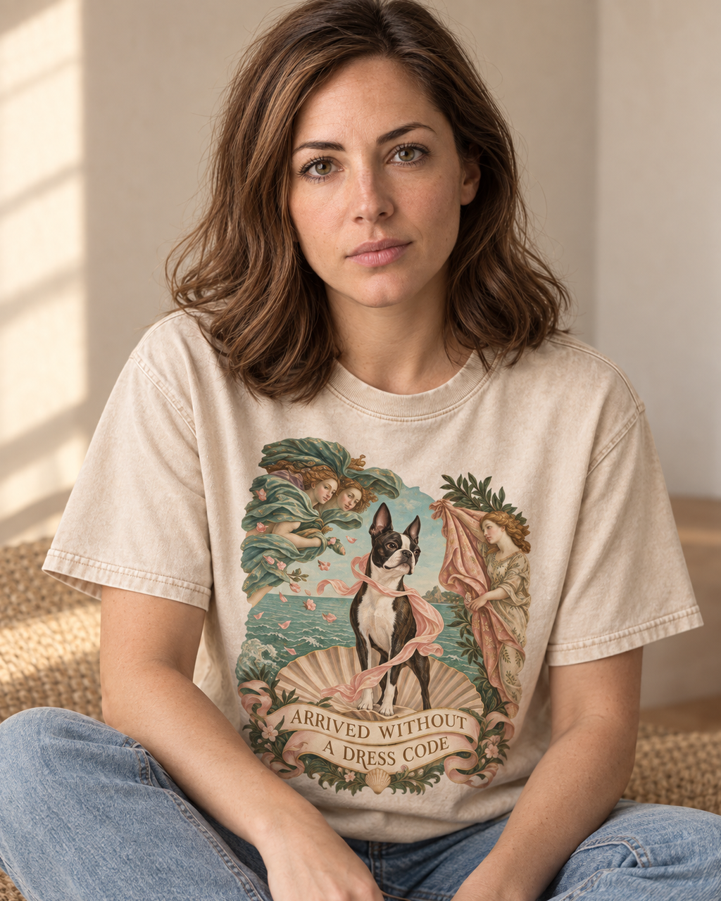 Adult model wears Apricot Boston Terrier Arrived Without a Dress Code Venus Parody washed T-shirt in a seated indoor portrai