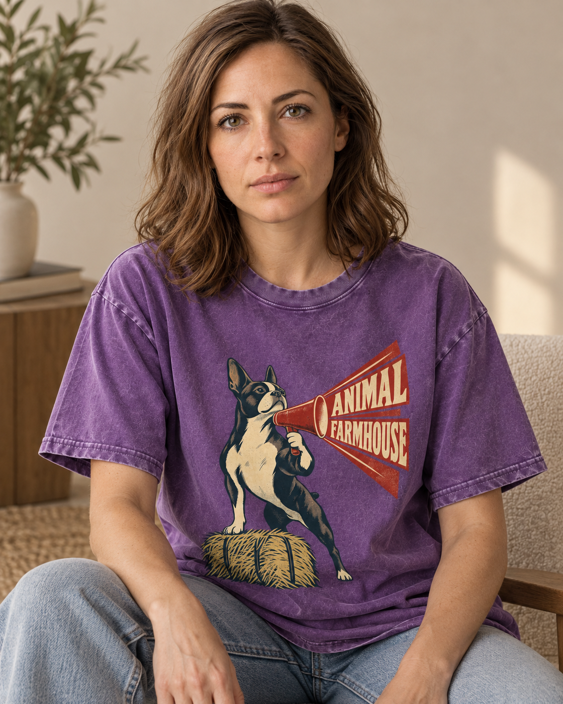 Adult model wears Purple Boston Terrier Animal Farmhouse washed T-shirt in a seated indoor portrait