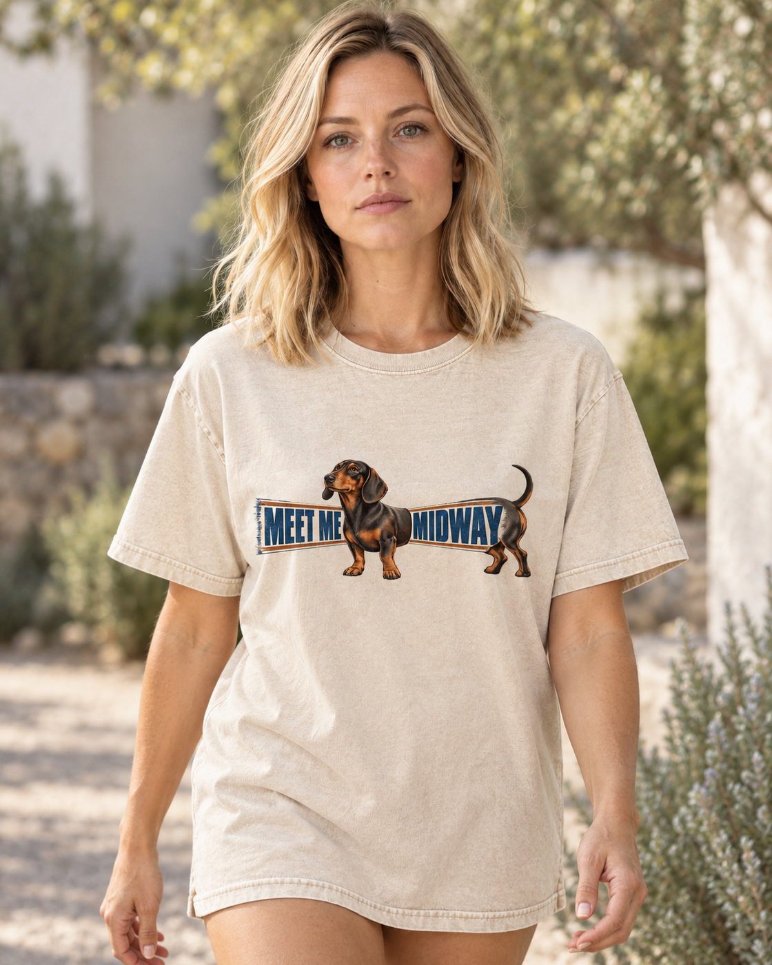 Adult model wears Apricot Dachshund Meet Me Midway Banner washed T-shirt in a natural walking portrait