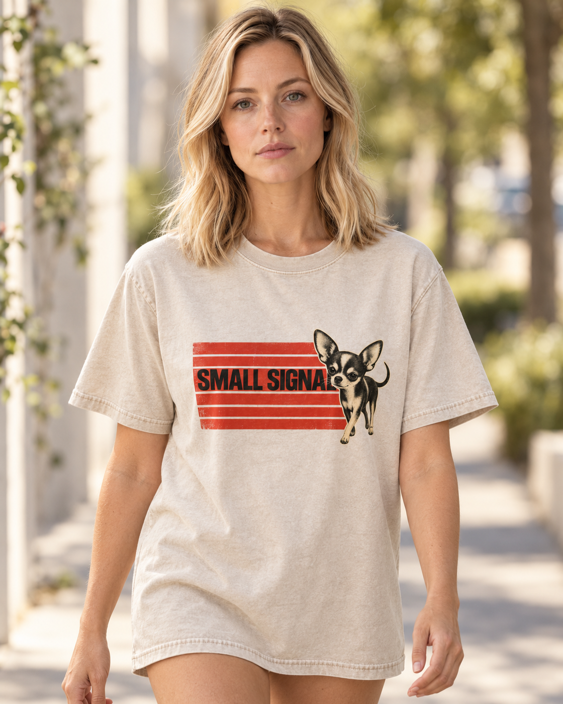 Adult model wears Apricot Chihuahua Small Signal washed T-shirt in a natural walking portrait