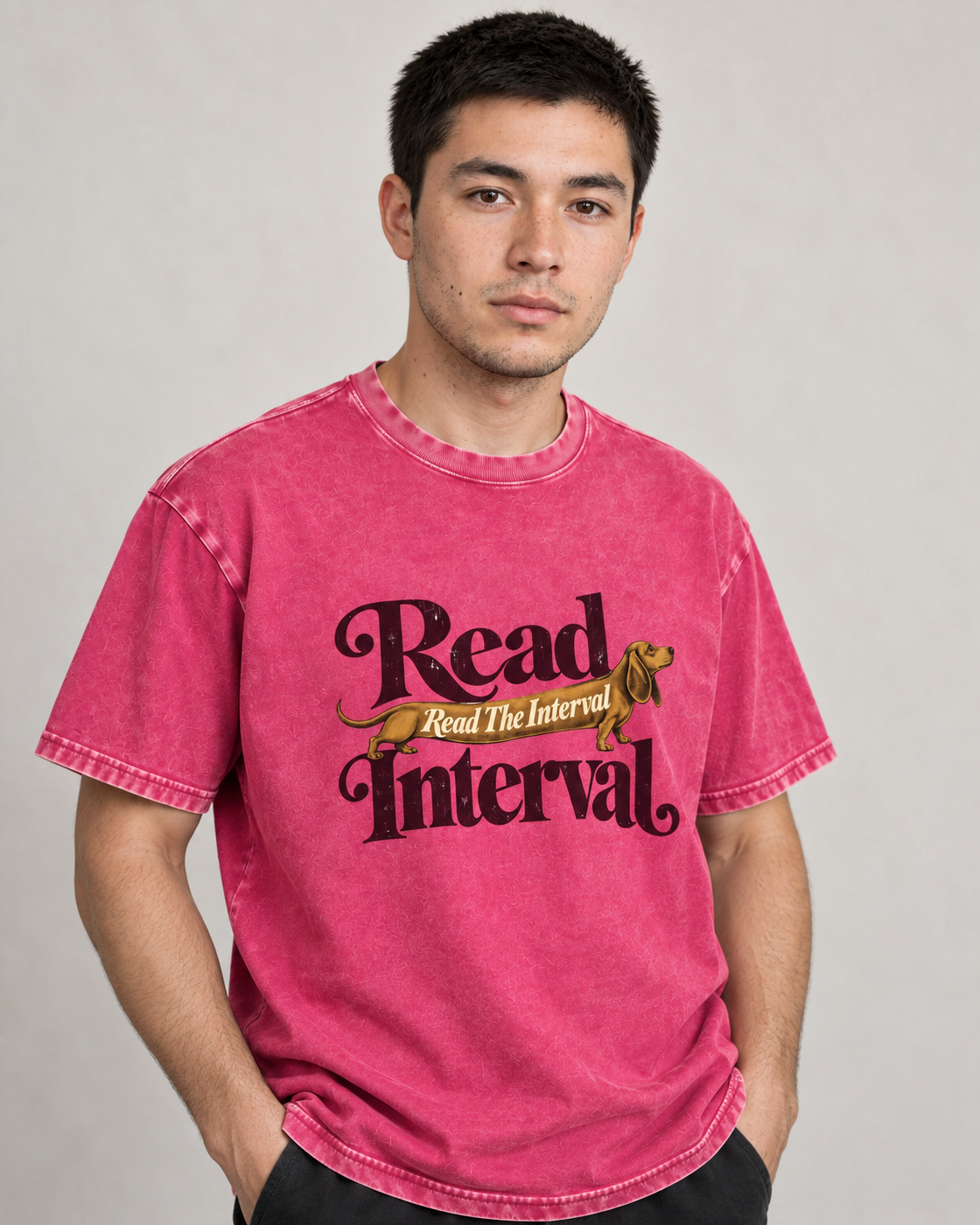 Adult model wears Fuchsia Dachshund Read The Interval Typographic washed T-shirt in a side-angle editorial portrait
