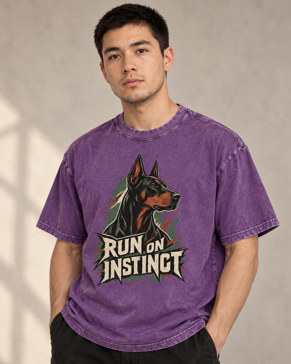Adult model wears Purple Doberman Run on Instinct Brush Slash washed T-shirt in a side-angle editorial portrait