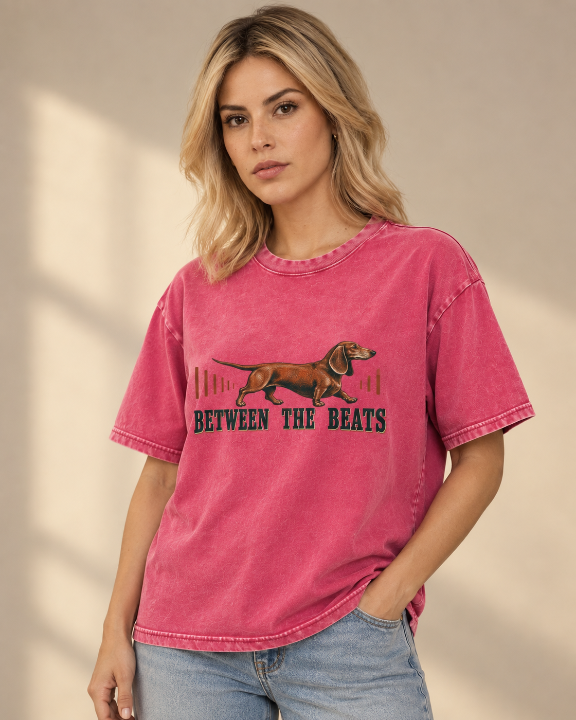 Adult model wears Fuchsia Dachshund Between The Beats Audio Wave washed T-shirt in a side-angle editorial portrait