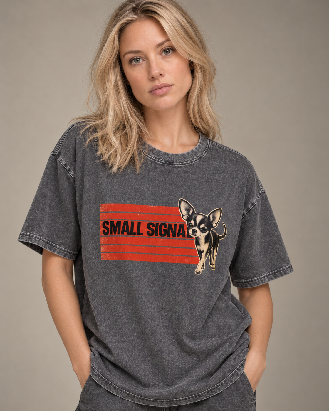 Adult model wears Gray Chihuahua Small Signal washed T-shirt in a side-angle editorial portrait