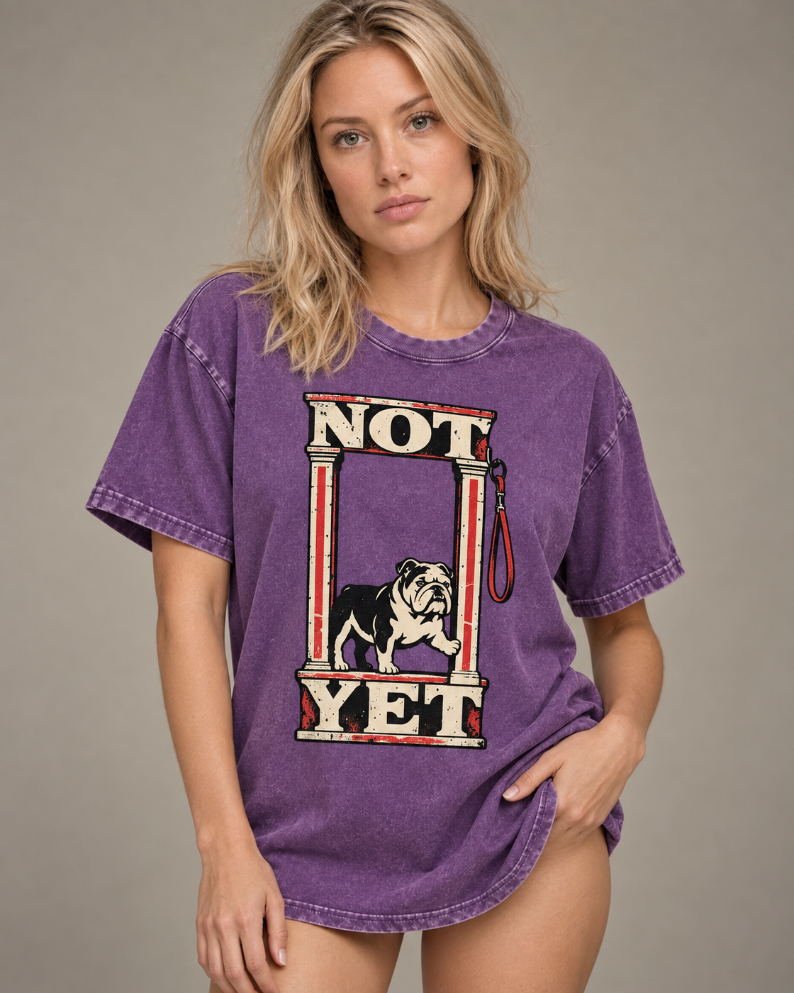 Adult model wears Purple English Bulldog Not Yet Doorway washed T-shirt in a side-angle editorial portrait