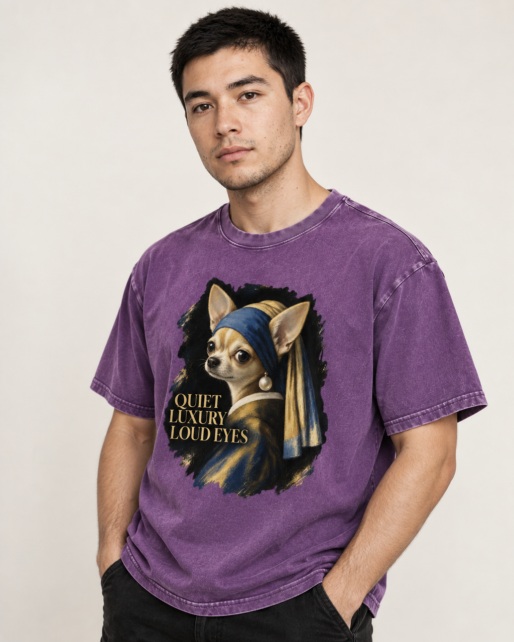Adult model wears Purple Chihuahua Quiet Luxury Loud Eyes Pearl Earring Portrait washed T-shirt in a side-angle editorial po
