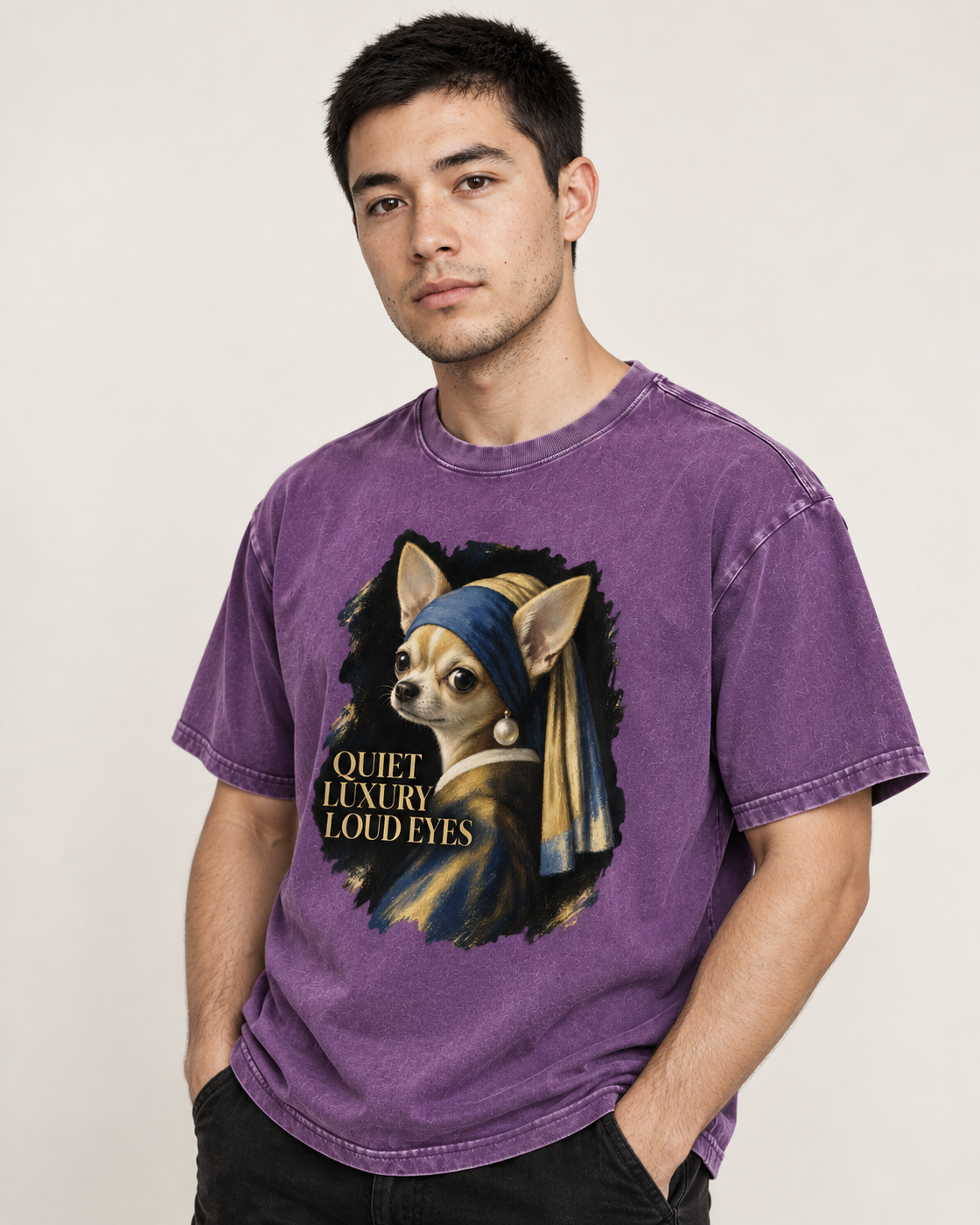 Adult model wears Purple Chihuahua Quiet Luxury Loud Eyes Pearl Earring Portrait washed T-shirt in a side-angle editorial po