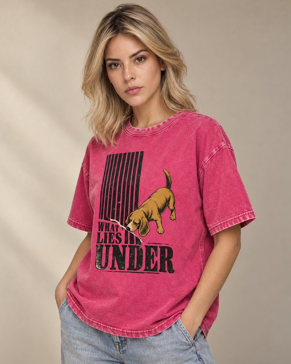 Adult model wears Fuchsia Beagle Curious What Lies Under washed T-shirt in a side-angle editorial portrait
