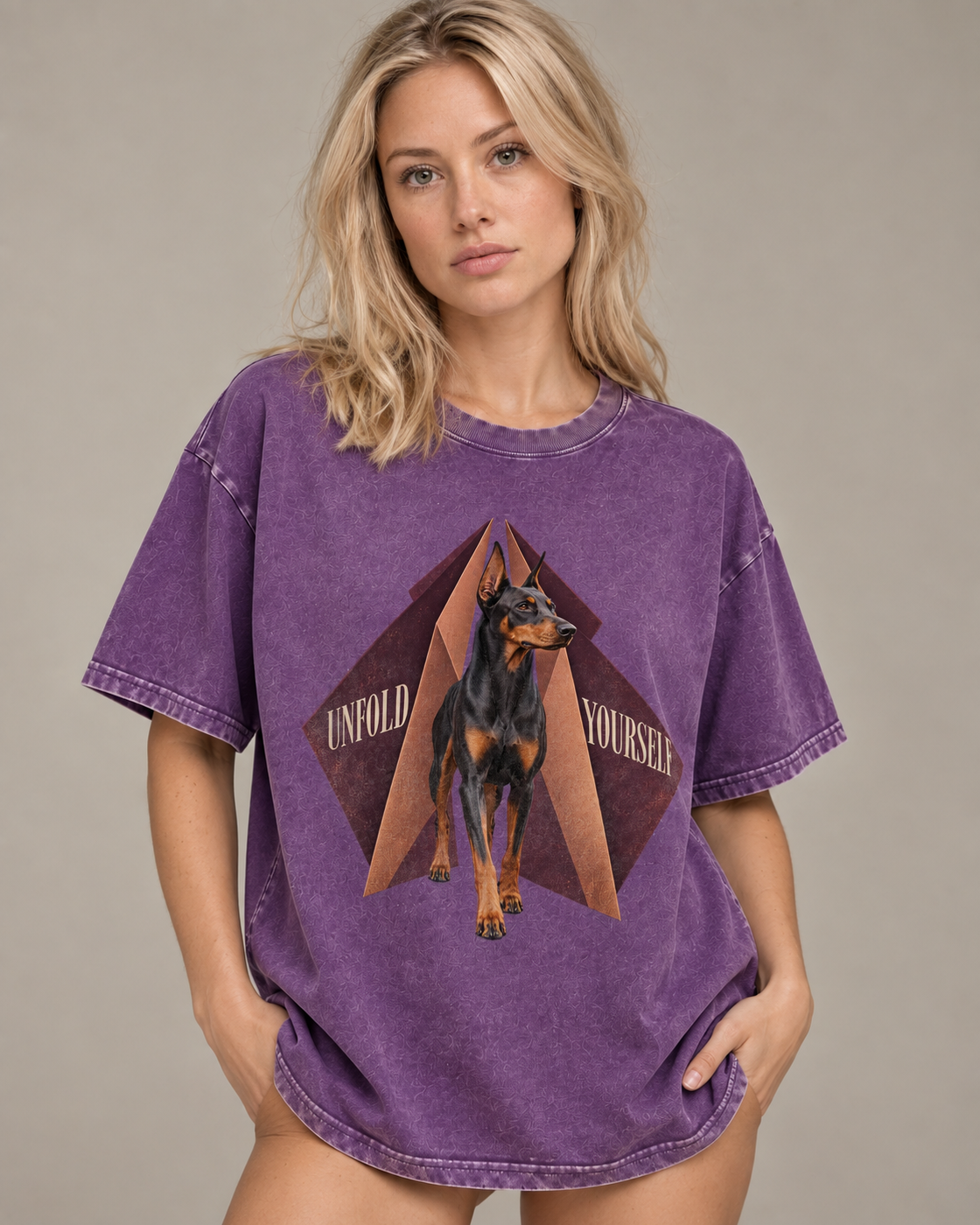 Adult model wears Purple Doberman Unfold Yourself Geometric Portrait washed T-shirt in a side-angle editorial portrait