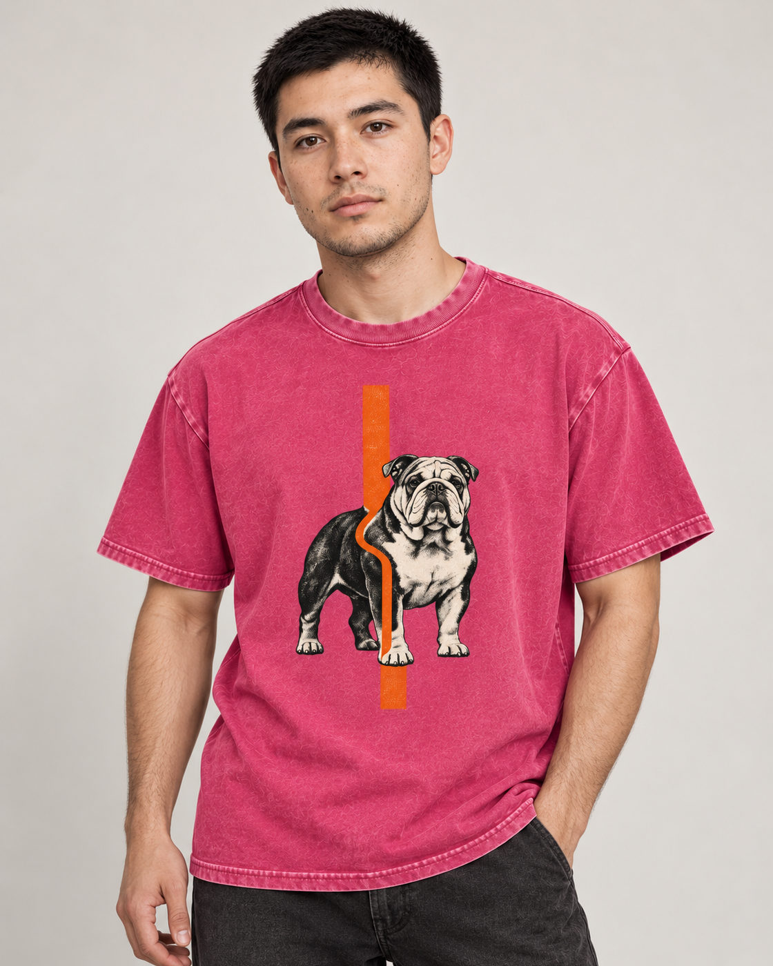 Adult model wears Fuchsia English Bulldog Orange Offset Line washed T-shirt in a side-angle editorial portrait