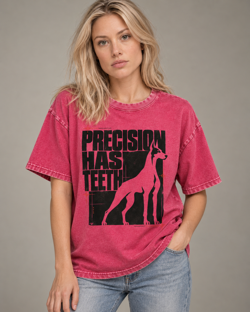 Adult model wears Fuchsia Doberman Precision Has Teeth washed T-shirt in a side-angle editorial portrait