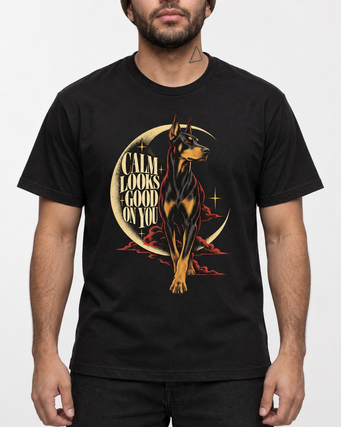 Doberman Calm Looks Good on You Crescent Graphic T-Shirt in Black, worn by a model, front view