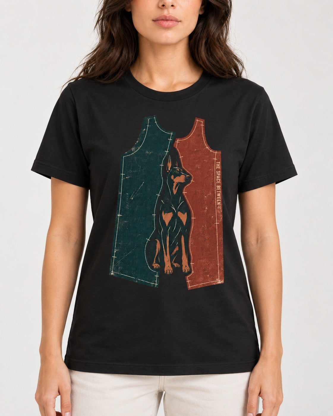 Doberman The Space Between Pattern Pieces Graphic T-Shirt in Black, worn by a model, front view