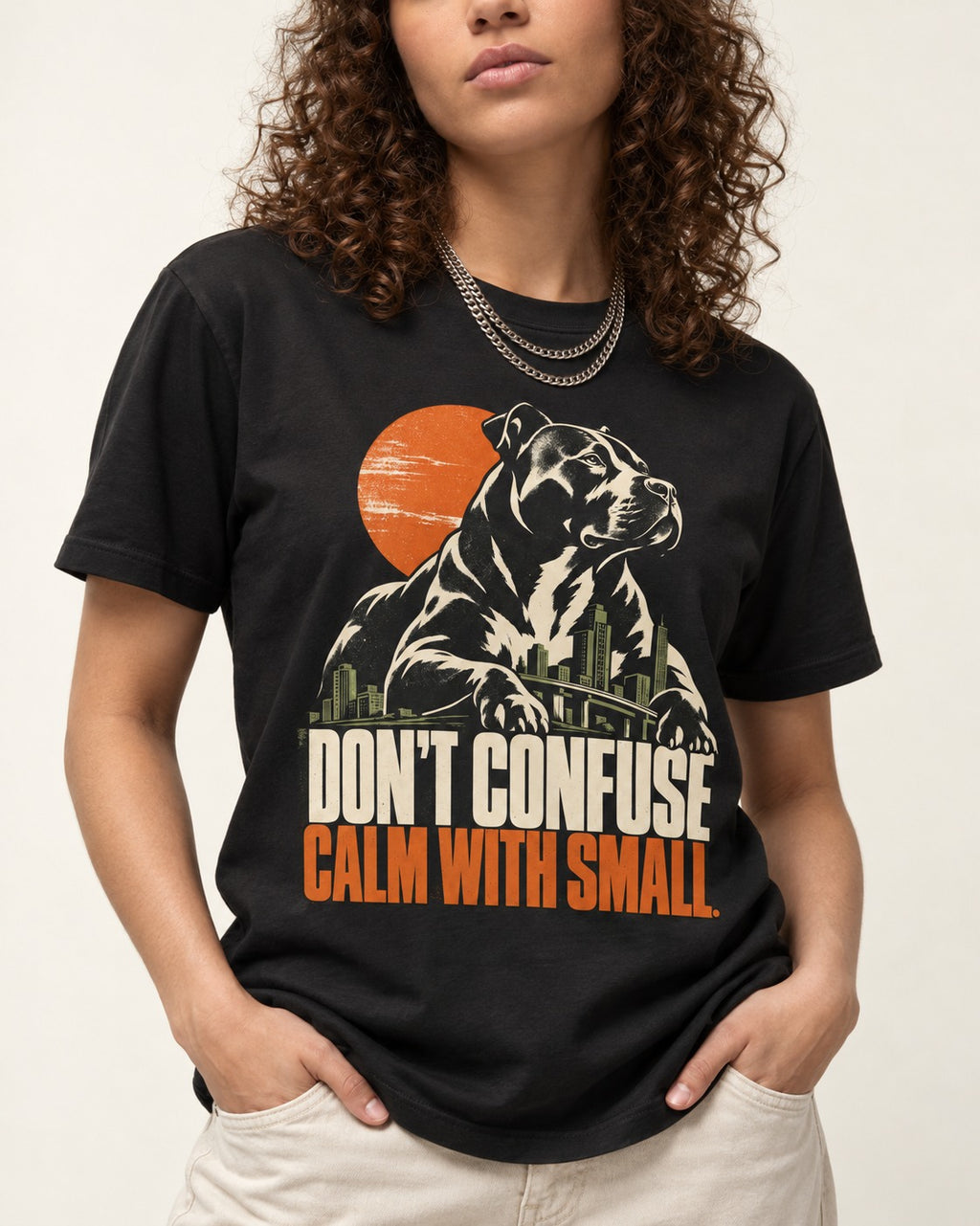 Pitbull Don't Confuse Calm with Small City Guardian Graphic T-Shirt in Black, worn by a model, front view
