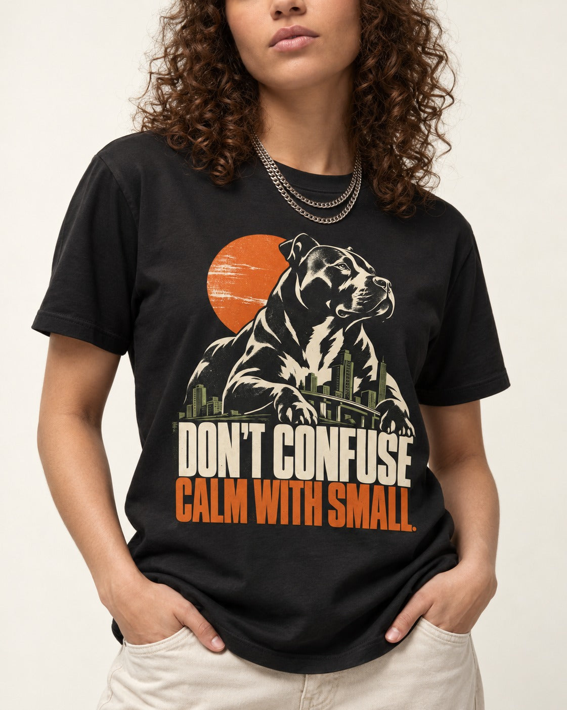 Pitbull Don't Confuse Calm with Small City Guardian Graphic T-Shirt in Black, worn by a model, front view