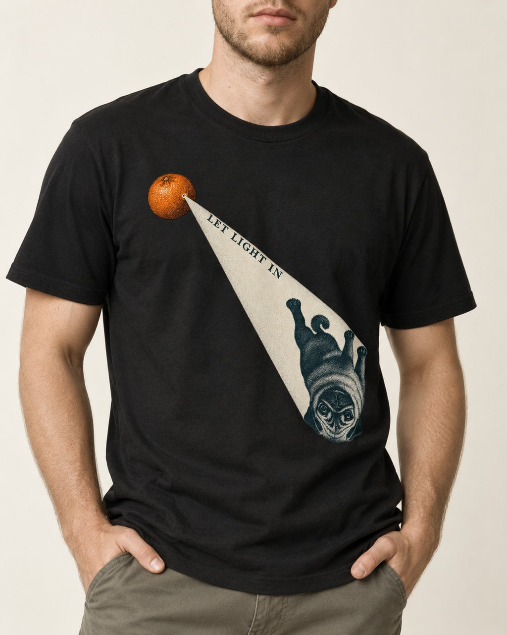 Pug Let Light In Camera Obscura Graphic T-Shirt in Black, worn by a model, front view