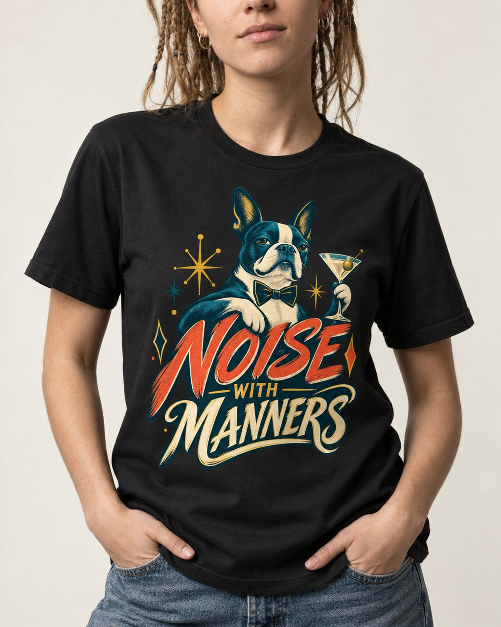 Boston Terrier Noise With Manners Cocktail Graphic T-Shirt in Black, worn by a model, front view