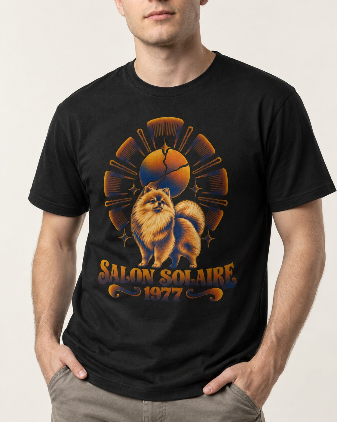 Pomeranian Salon Solaire 1977 Hairbrush Halo Graphic T-Shirt in Black, worn by a model, front view