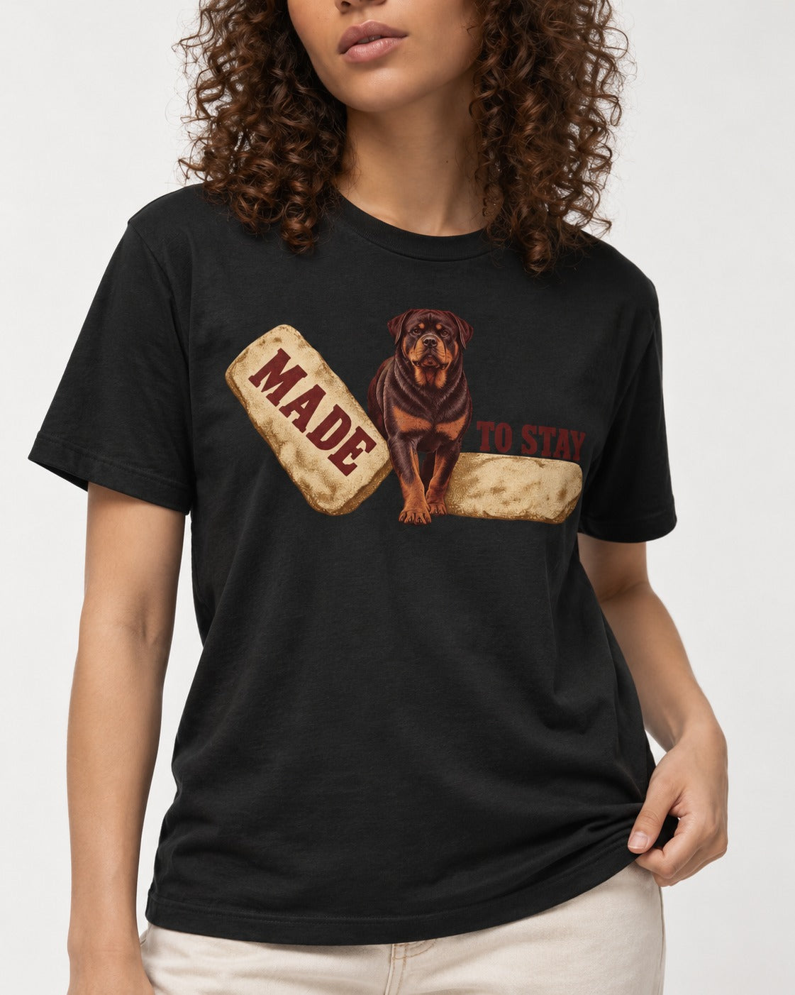 Rottweiler Made to Stay Stepping Stone Graphic T-Shirt in Black, worn by a model, front view