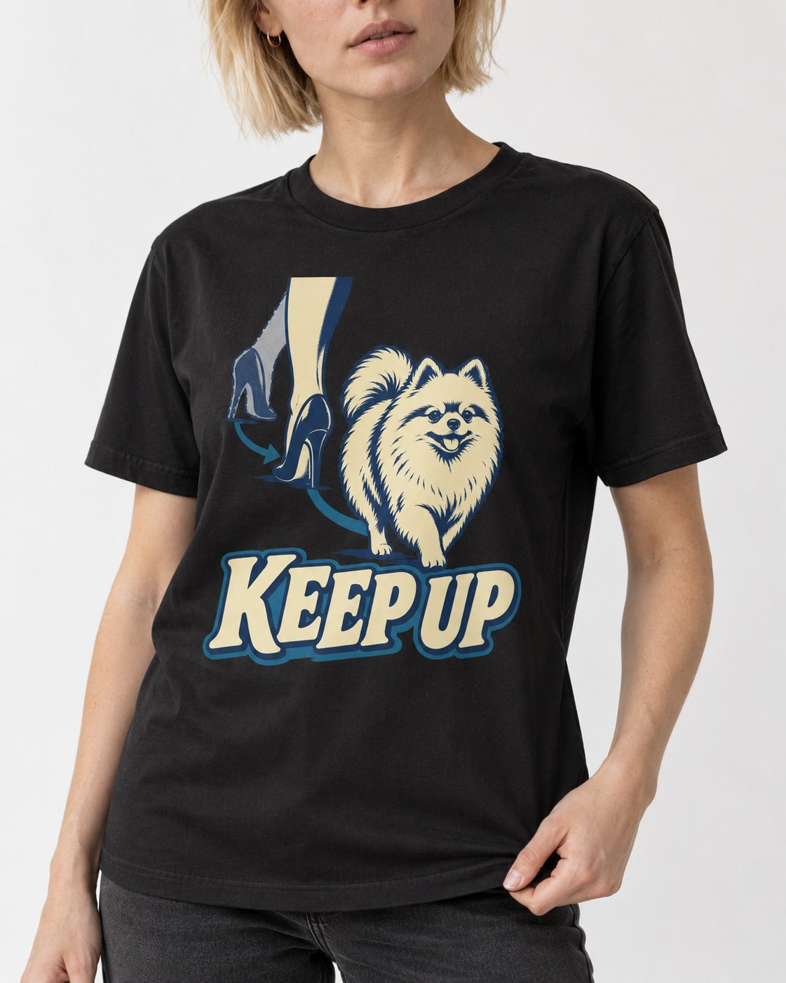 Pomeranian Keep Up High Heel Chase Graphic T-Shirt in Black, worn by a model, front view