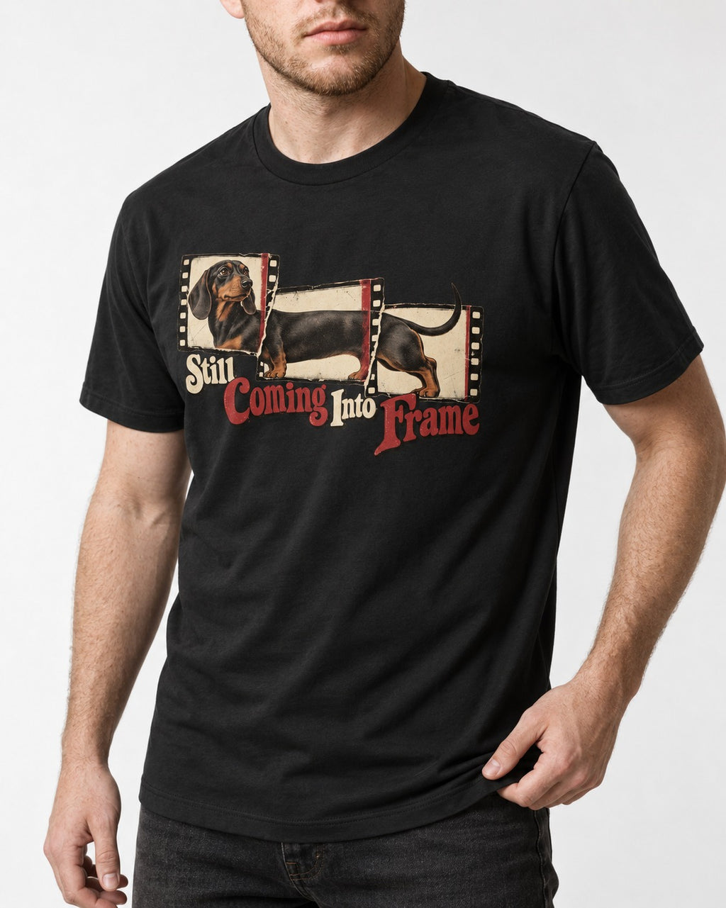 Dachshund Still Coming Into Frame Vintage Filmstrip Graphic T-Shirt in Black, worn by a model, front view