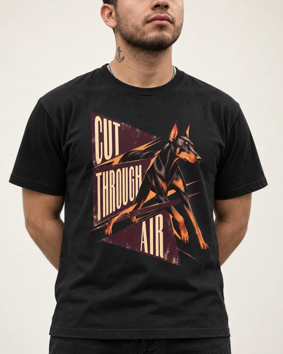 Doberman Cut Through Air Graphic T-Shirt in Black, worn by a model, front view