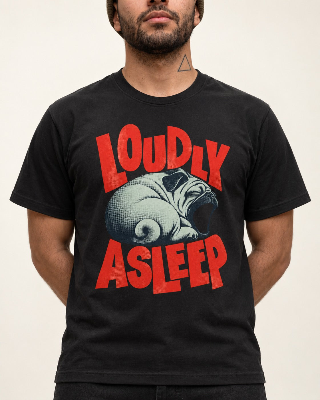 Pug Loudly Asleep Curled Yawn Graphic T-Shirt in Black, worn by a model, front view