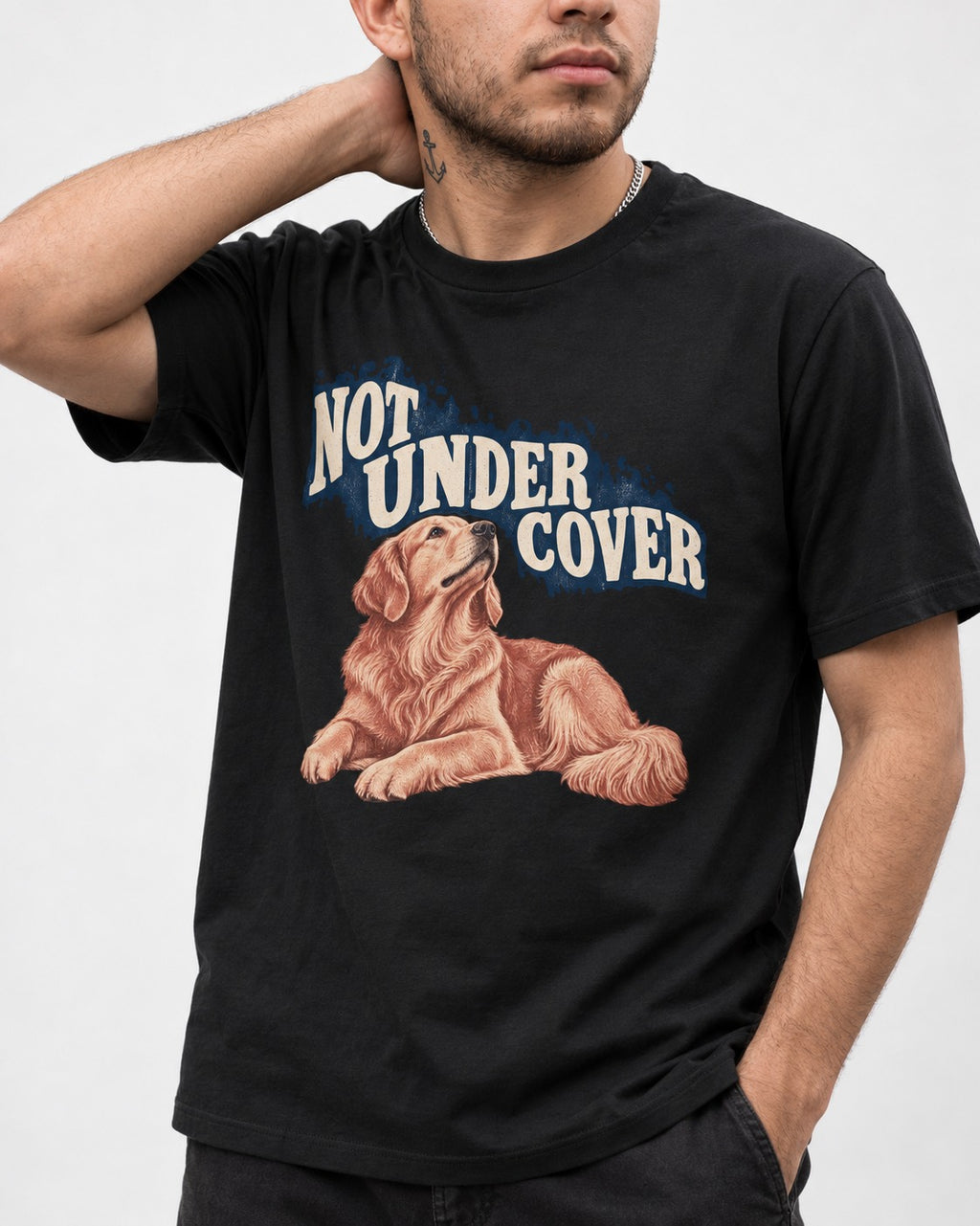 Not Under Cover Reclining Golden Retriever Graphic T-Shirt in Black, worn by a model, front view