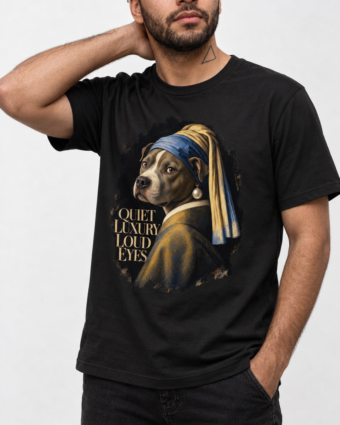 Pitbull Quiet Luxury Loud Eyes Pearl Earring Portrait Graphic T-Shirt in Black, worn by a model, front view