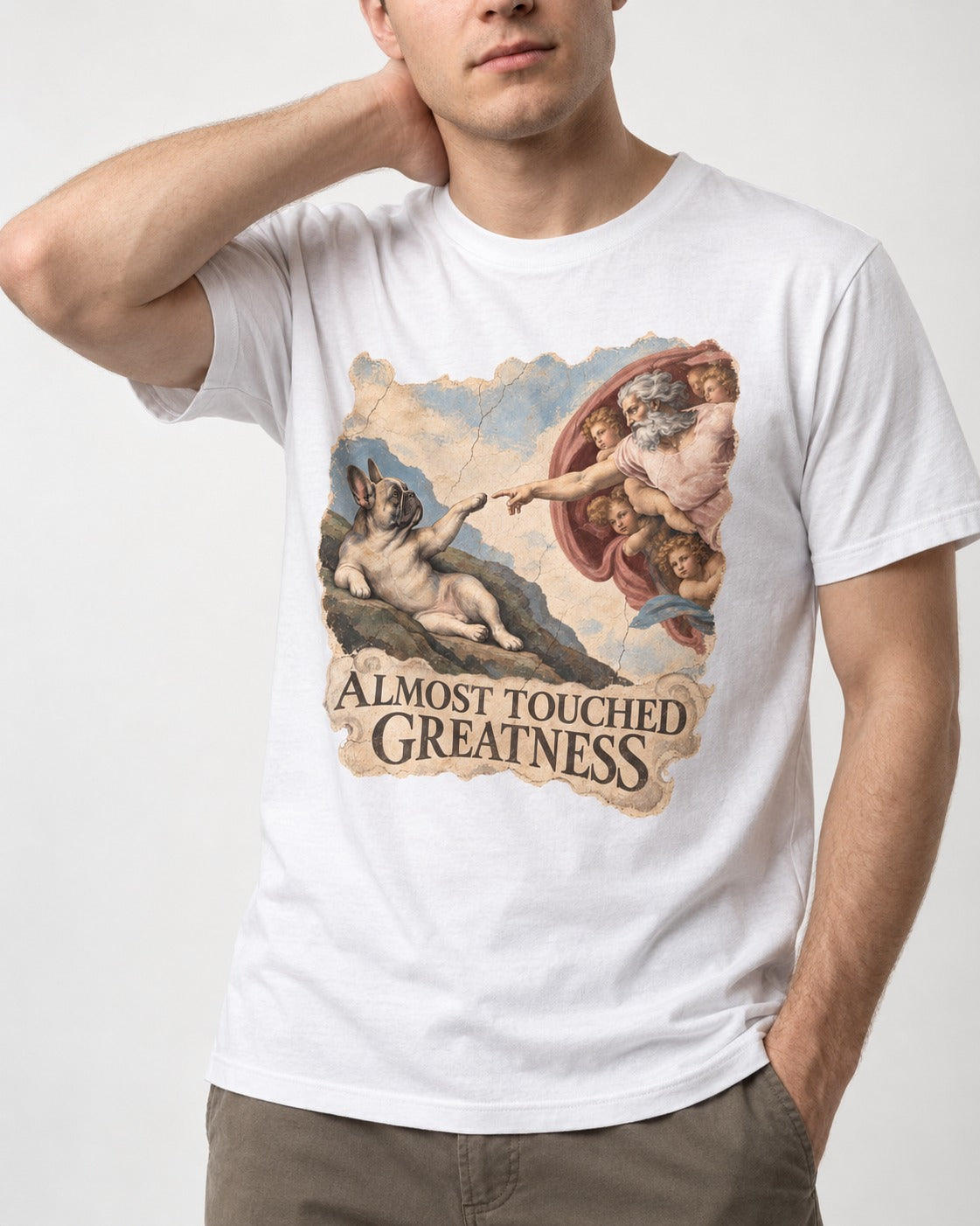 Frenchie Almost Touched Greatness T-Shirt in White, worn by a model, front view