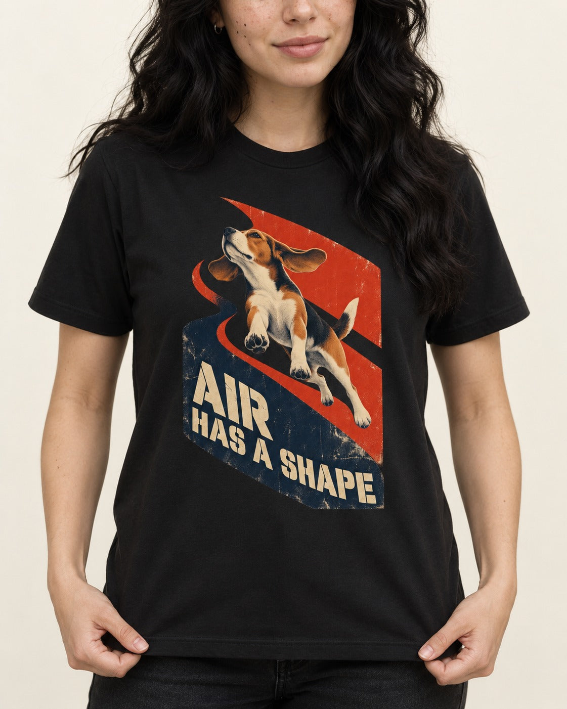 Air Has A Shape Beagle Jumping Graphic T-Shirt in Black, worn by a model, front view