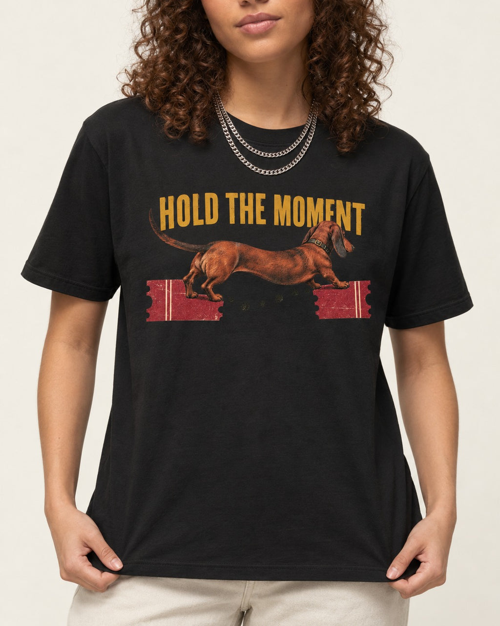 Dachshund Hold The Moment Torn Ticket Bridge Graphic T-Shirt in Black, worn by a model, front view