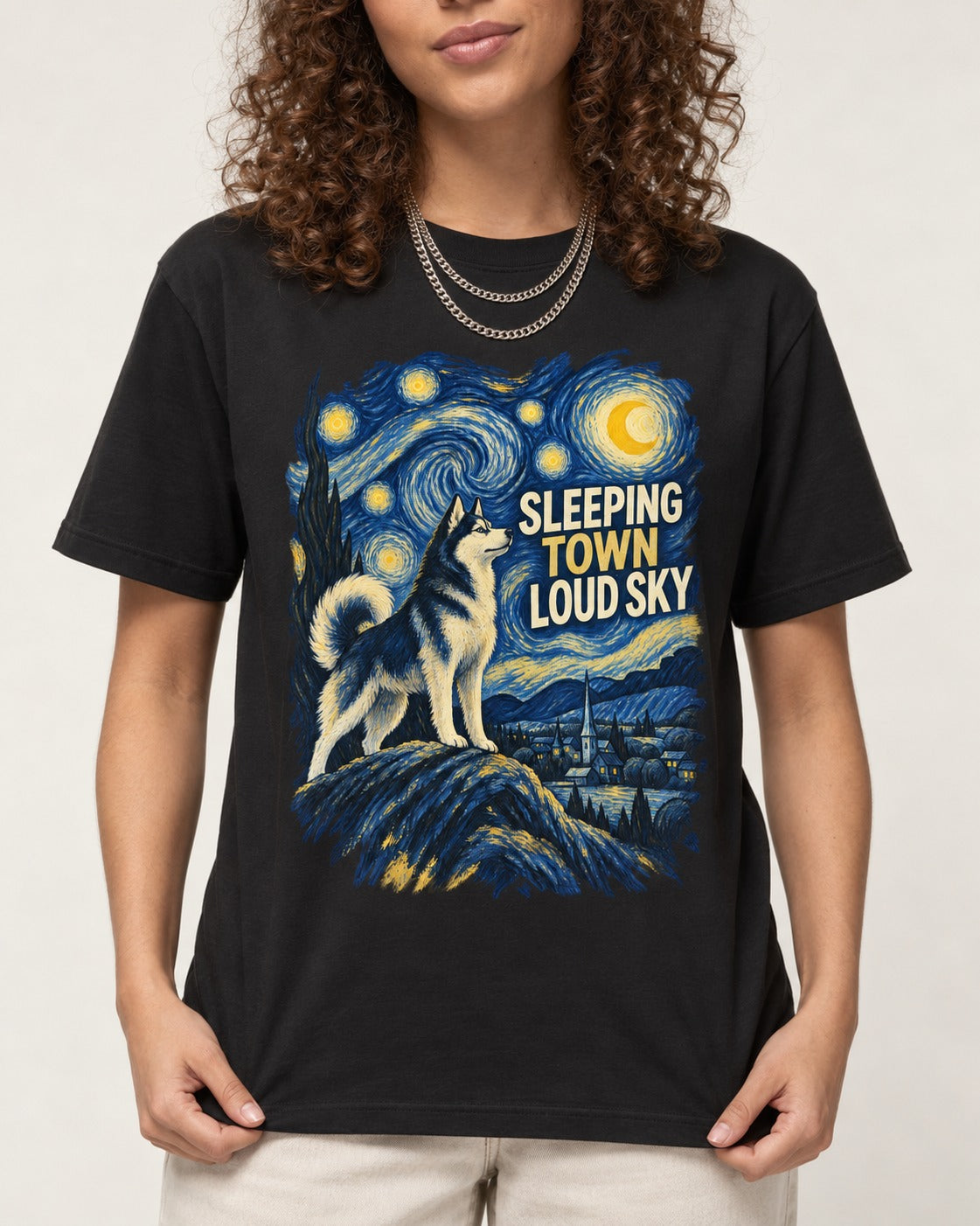 Husky Sleeping Town Loud Sky Starry Night Graphic T-Shirt in Black, worn by a model, front view